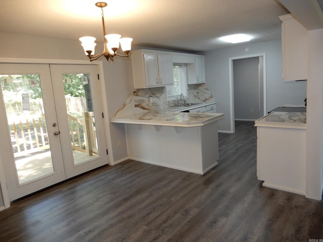100 Douglas, Judsonia, AR 72180 - kitchen featuring french doors, light countertops, healthy amount of natural light, and dark wood-type flooring