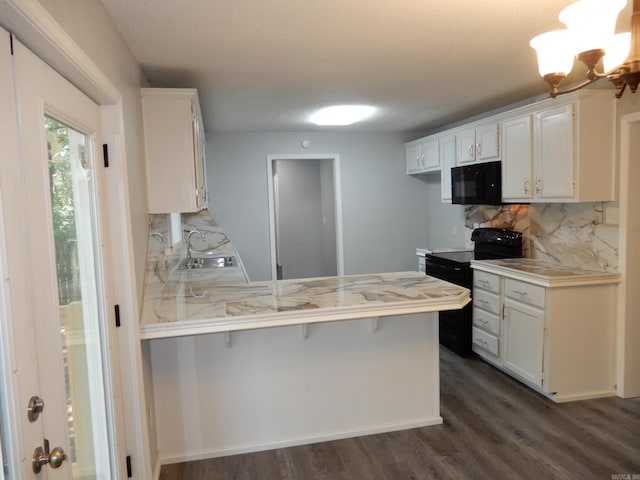 100 Douglas, Judsonia, AR 72180 - kitchen featuring black appliances, a peninsula, light countertops, and backsplash