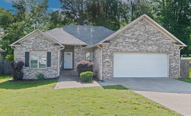 3 Mystery Cv, Little Rock, AR 72209 - view of front of property with a garage, driveway, a shingled roof, and brick siding