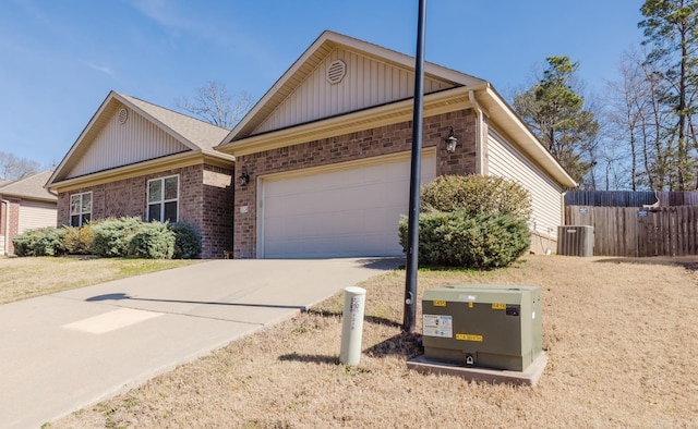 1324 Hunter Wood, Bryant, AR 72022 - ranch-style house featuring an attached garage, concrete driveway, brick siding, cooling unit, and board and batten siding