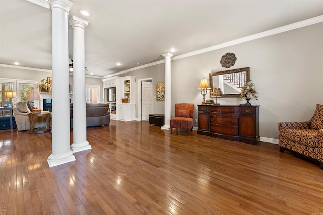 3305 Seminole Trl, Sherwood, AR 72120 - living area with decorative columns, hardwood / wood-style floors, recessed lighting, crown molding, and baseboards