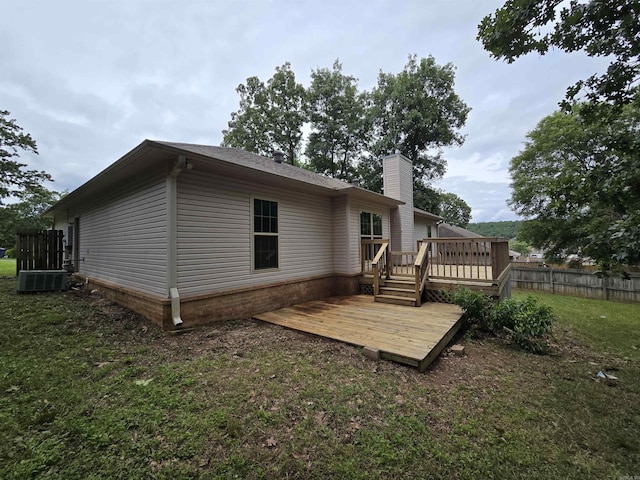 19 Twin Lks, Cabot, AR 72023 - back of house featuring a wooden deck, a chimney, and central air condition unit