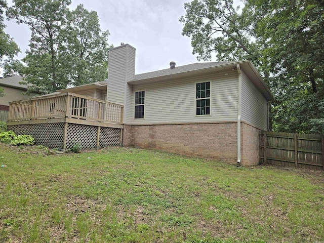 19 Twin Lks, Cabot, AR 72023 - back of property featuring brick siding, a chimney, and a deck