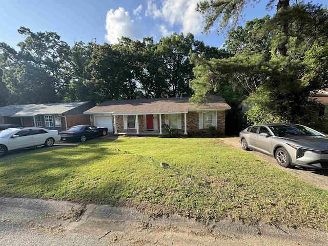 ranch-style house with a garage, a front lawn, a porch, driveway, and brick siding