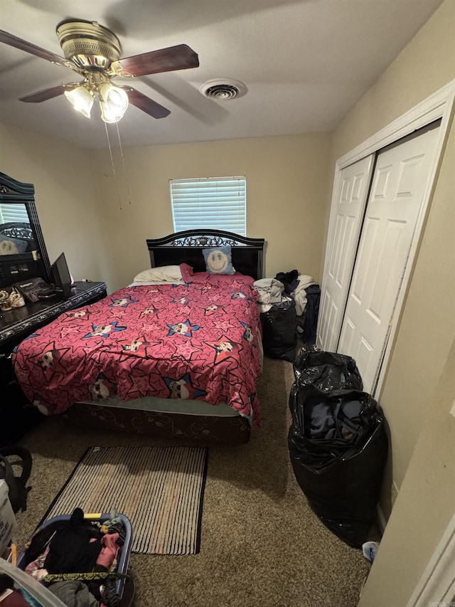 bedroom featuring carpet, a closet, and a ceiling fan