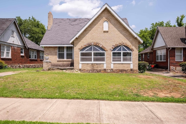 2815 Broadway St, Little Rock, AR 72206 - tudor house with a chimney, brick siding, and a front yard