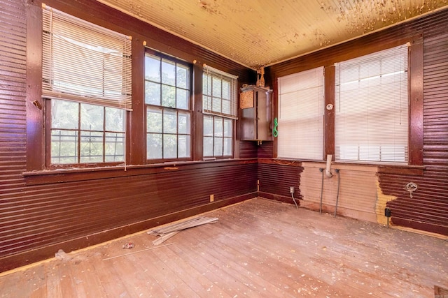 2815 Broadway St, Little Rock, AR 72206 - spare room with hardwood / wood-style floors, wooden walls, and plenty of natural light