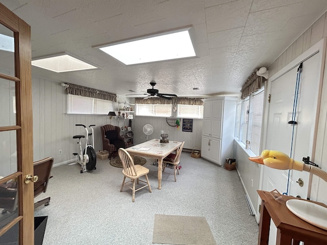 13 Many Moons Trce, Cherokee Village, AR 72529 - dining space with a skylight, plenty of natural light, a ceiling fan, and baseboards