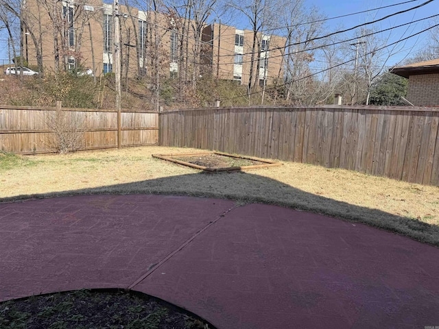 fenced backyard with a patio area