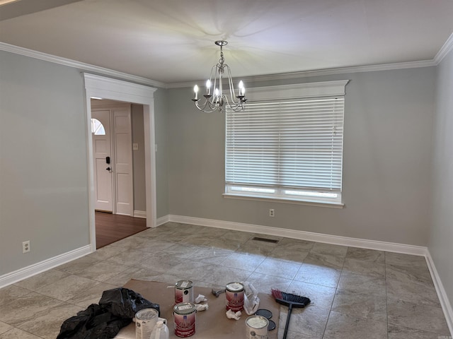 unfurnished dining area featuring baseboards, a chandelier, and crown molding
