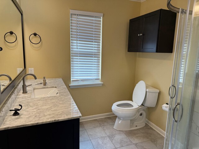 full bath featuring baseboards, vanity, toilet, and a shower stall