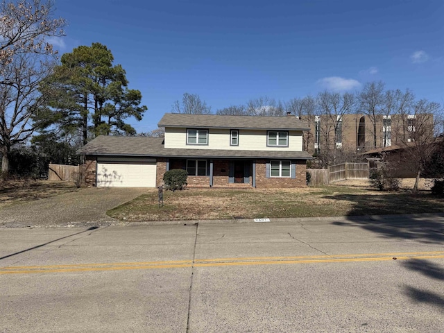 traditional-style house featuring concrete driveway, an attached garage, a porch, and brick siding