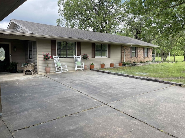 6873 Brazil Rd, Benton, AR 72019 - ranch-style house with a front lawn and a shingled roof