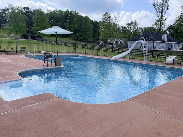 6873 Brazil Rd, Benton, AR 72019 - view of swimming pool featuring a water slide and a patio