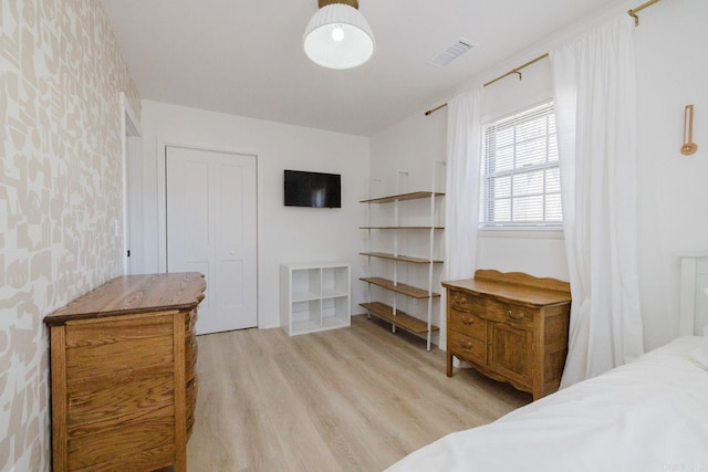 6873 Brazil Rd, Benton, AR 72019 - bedroom with light wood-style flooring and wallpapered walls