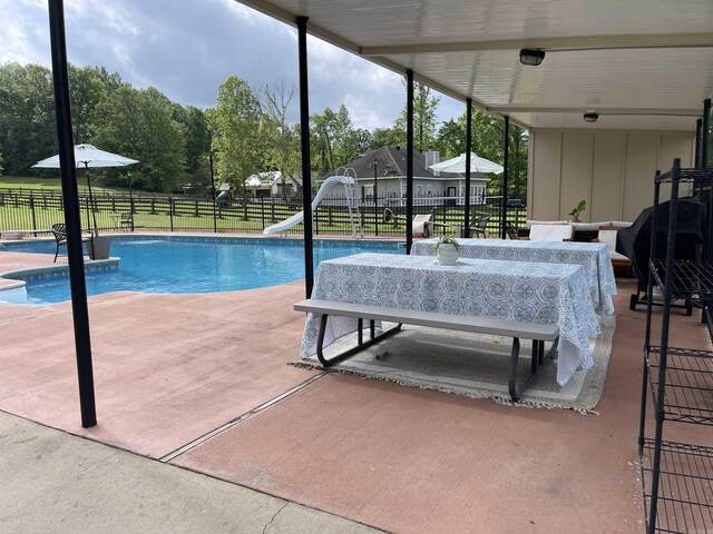 6873 Brazil Rd, Benton, AR 72019 - view of pool featuring a water slide, a fenced backyard, and a patio
