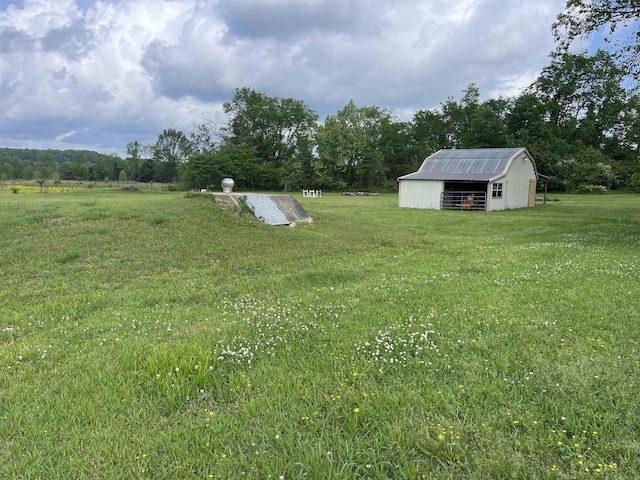 6873 Brazil Rd, Benton, AR 72019 - view of green lawn featuring an outdoor structure