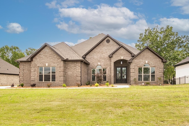 50 Wellington Pl, Cabot, AR 72023 - french country style house with brick siding, french doors, and roof with shingles