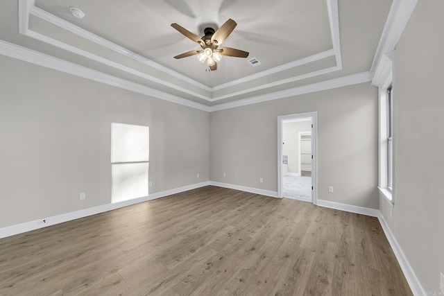 50 Wellington Pl, Cabot, AR 72023 - empty room featuring a tray ceiling, a ceiling fan, light wood-type flooring, ornamental molding, and baseboards