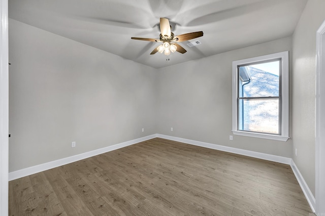 50 Wellington Pl, Cabot, AR 72023 - spare room featuring ceiling fan, wood finished floors, and baseboards