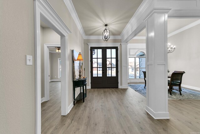 50 Wellington Pl, Cabot, AR 72023 - entrance foyer featuring a chandelier, wood finished floors, french doors, baseboards, and crown molding