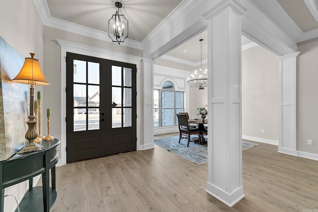 50 Wellington Pl, Cabot, AR 72023 - entrance foyer with a chandelier, french doors, light wood-style flooring, crown molding, and baseboards