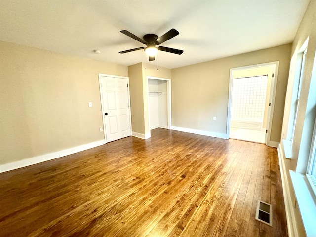 3317 W 7th St, Little Rock, AR 72205 - unfurnished bedroom with hardwood / wood-style floors, a closet, a ceiling fan, and baseboards
