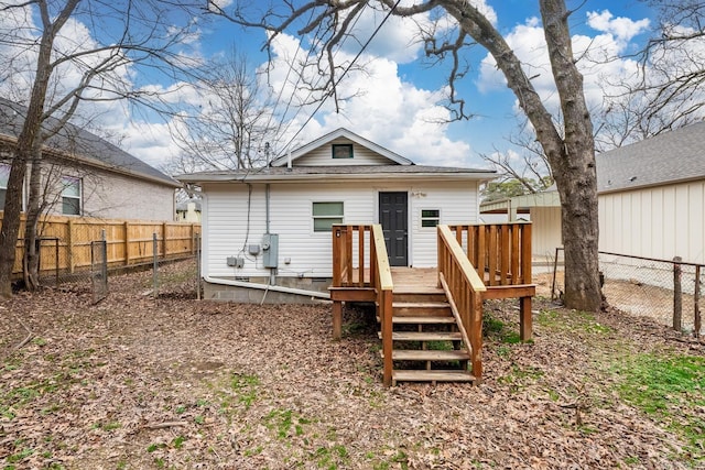 3317 W 7th St, Little Rock, AR 72205 - rear view of property featuring a deck, a fenced backyard, and roof with shingles