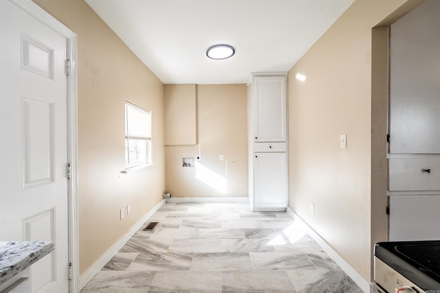 3317 W 7th St, Little Rock, AR 72205 - laundry area featuring washer hookup, baseboards, and light marble finish floors