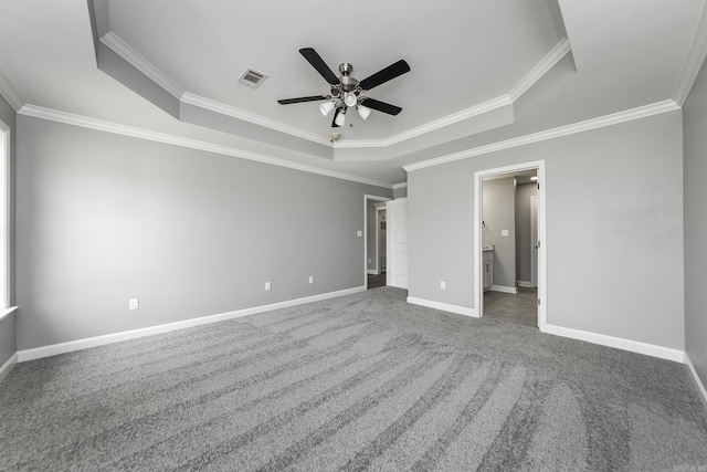 5201 Canter Ln, Jacksonville, AR 72076 - unfurnished bedroom featuring a raised ceiling, ornamental molding, carpet, baseboards, and ensuite bathroom