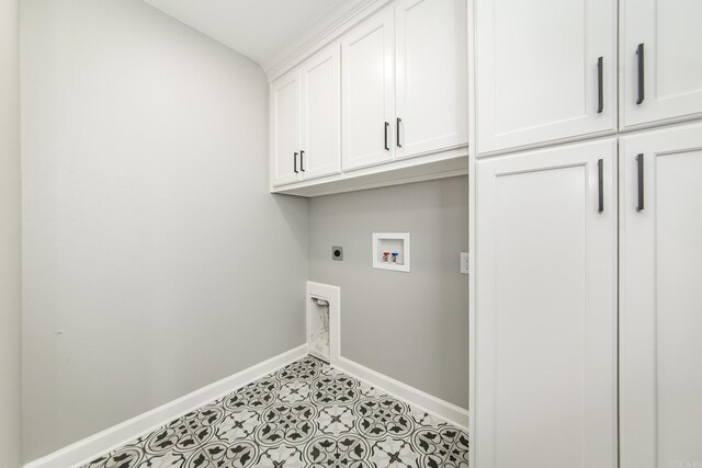 5201 Canter Ln, Jacksonville, AR 72076 - washroom with cabinet space, electric dryer hookup, baseboards, and washer hookup