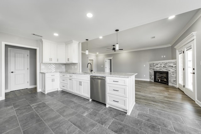5201 Canter Ln, Jacksonville, AR 72076 - kitchen with dishwasher, a peninsula, a sink, crown molding, and baseboards