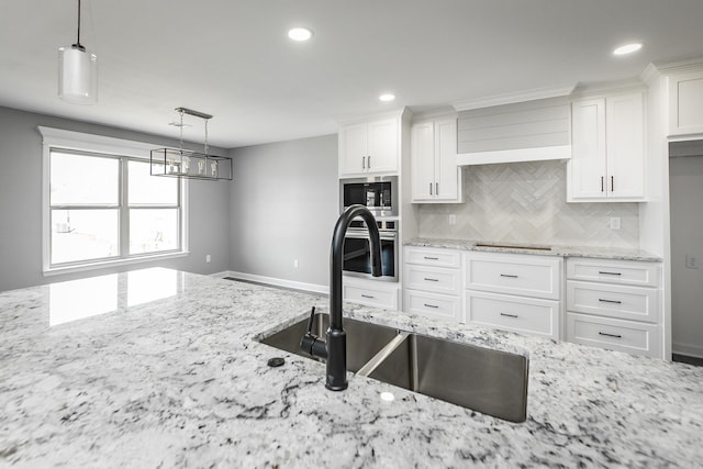 5201 Canter Ln, Jacksonville, AR 72076 - kitchen with a sink, tasteful backsplash, stainless steel appliances, white cabinetry, and recessed lighting