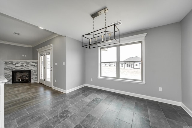 5201 Canter Ln, Jacksonville, AR 72076 - unfurnished living room featuring a chandelier, baseboards, crown molding, and a fireplace