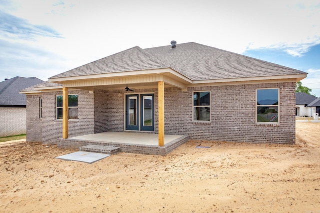 5201 Canter Ln, Jacksonville, AR 72076 - back of property featuring a shingled roof, ceiling fan, and brick siding