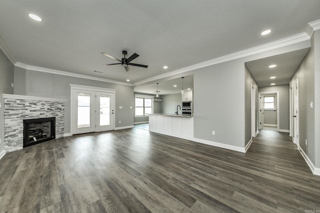 5201 Canter Ln, Jacksonville, AR 72076 - unfurnished living room with a ceiling fan, baseboards, dark wood-style flooring, recessed lighting, and ornamental molding