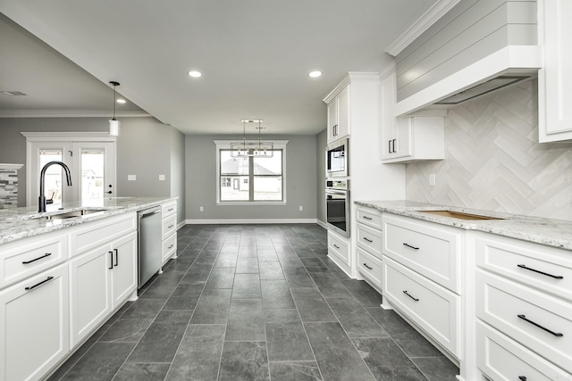 5201 Canter Ln, Jacksonville, AR 72076 - kitchen featuring a sink, stainless steel appliances, backsplash, white cabinetry, and recessed lighting
