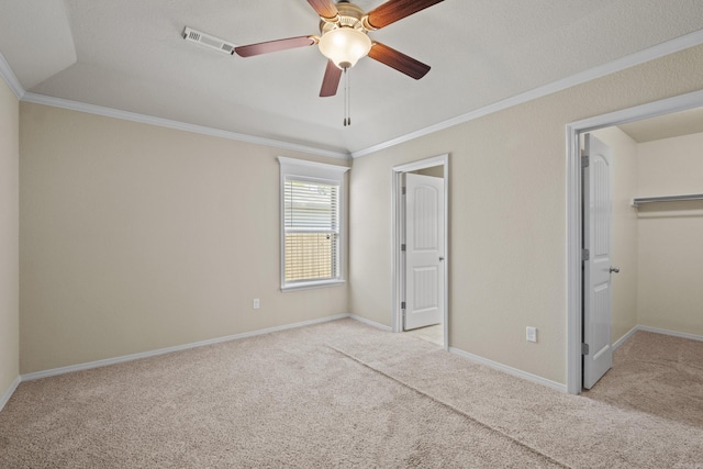 4114 Valles Rd, North Little Rock, AR 72118 - unfurnished bedroom featuring light colored carpet, ornamental molding, a spacious closet, baseboards, and ceiling fan