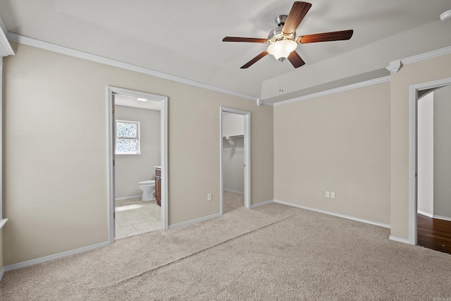 4114 Valles Rd, North Little Rock, AR 72118 - unfurnished bedroom featuring crown molding, carpet floors, connected bathroom, a walk in closet, and baseboards