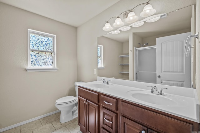 4114 Valles Rd, North Little Rock, AR 72118 - bathroom with a stall shower, double vanity, baseboards, toilet, and tile patterned floors