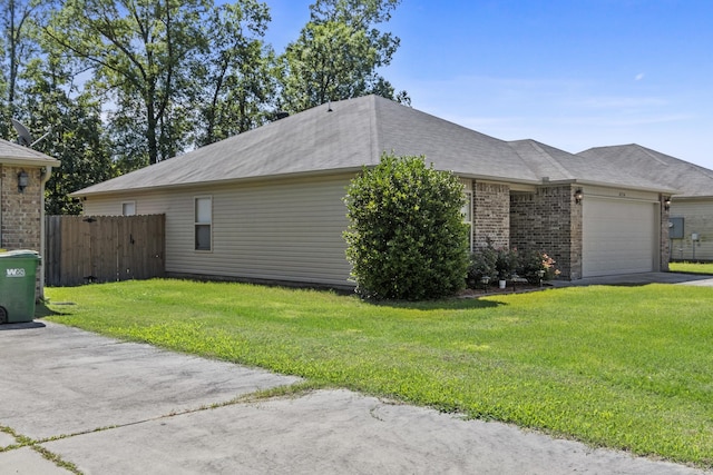 4114 Valles Rd, North Little Rock, AR 72118 - view of home's exterior with an attached garage, brick siding, driveway, and roof with shingles