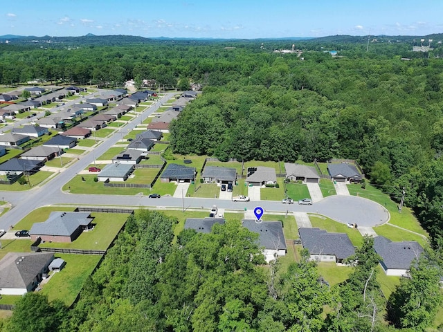 4114 Valles Rd, North Little Rock, AR 72118 - aerial overview of property's location with a heavily wooded area and nearby suburban area