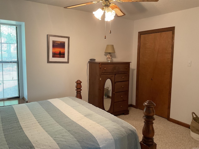 235 Sylvan Dr, Greers Ferry, AR 72067 - bedroom featuring light carpet, baseboards, and a ceiling fan