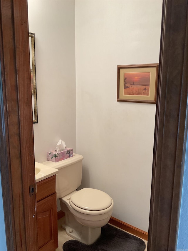 235 Sylvan Dr, Greers Ferry, AR 72067 - bathroom featuring vanity, toilet, and baseboards
