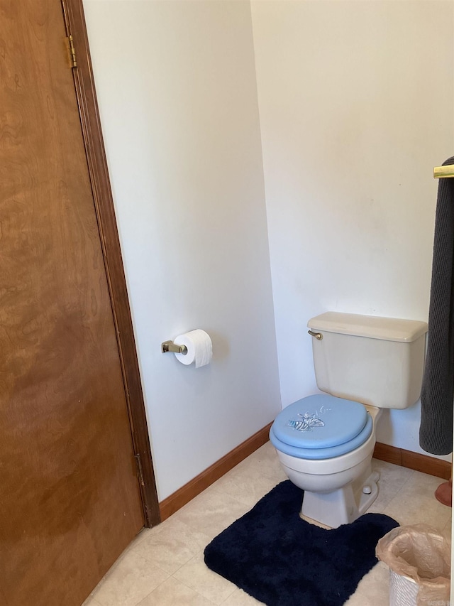 235 Sylvan Dr, Greers Ferry, AR 72067 - bathroom with toilet, tile patterned floors, and baseboards
