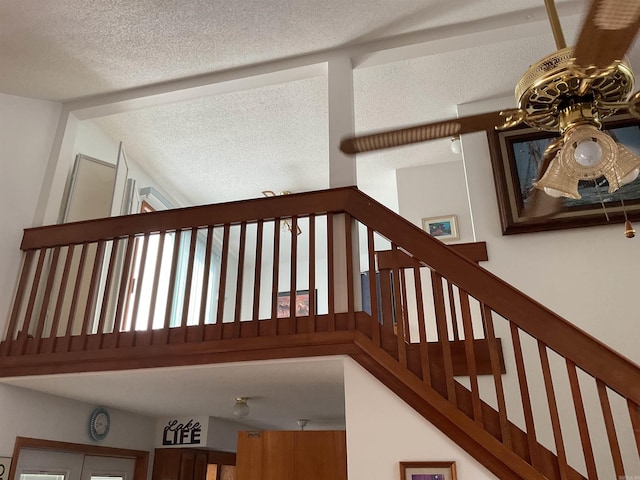 235 Sylvan Dr, Greers Ferry, AR 72067 - staircase with a textured ceiling