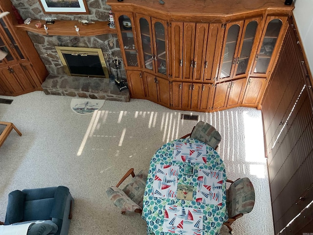 235 Sylvan Dr, Greers Ferry, AR 72067 - carpeted living area featuring a stone fireplace