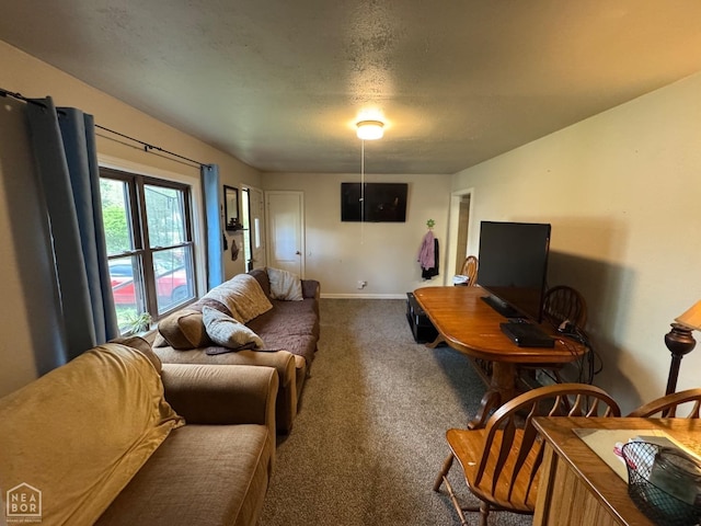 living area featuring carpet floors and baseboards
