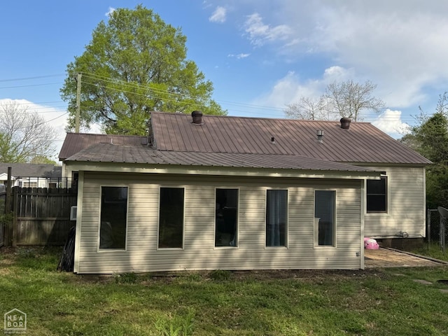 rear view of house with metal roof