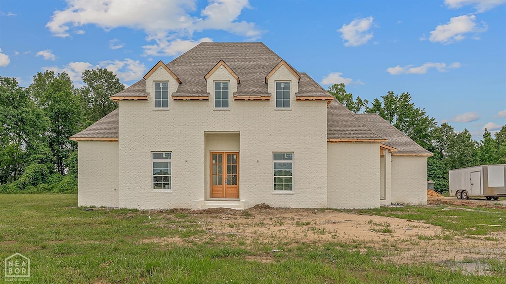 149 County Road 7127, Jonesboro, AR 72405 - back of house featuring a shingled roof and a lawn